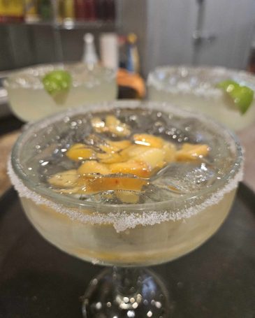 Margarita: "A refreshing margarita served in a salted-rim glass, garnished with a lime wedge, capturing the vibrant spirit of Norma's Cocina."